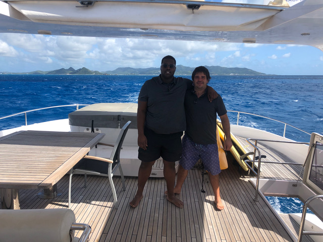 Cpt. Karl Reed (left) with other Reliance captain, Cpt. Dylan La Roux on the deck of a yacht in the Caribbean